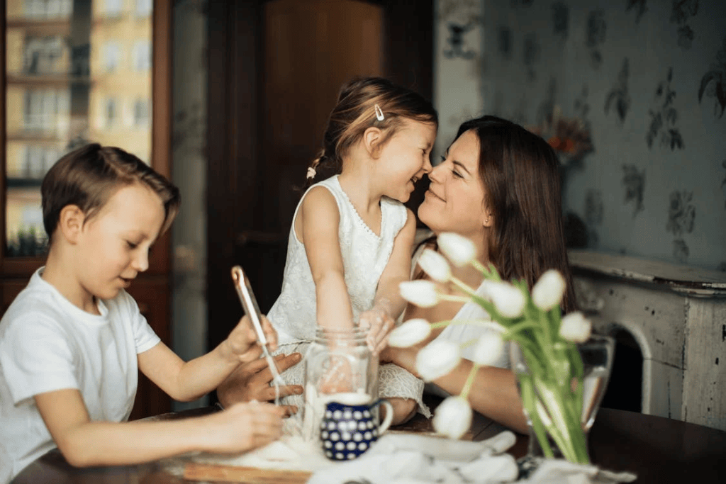 Mother playing with her children, highlighting everyday family connection