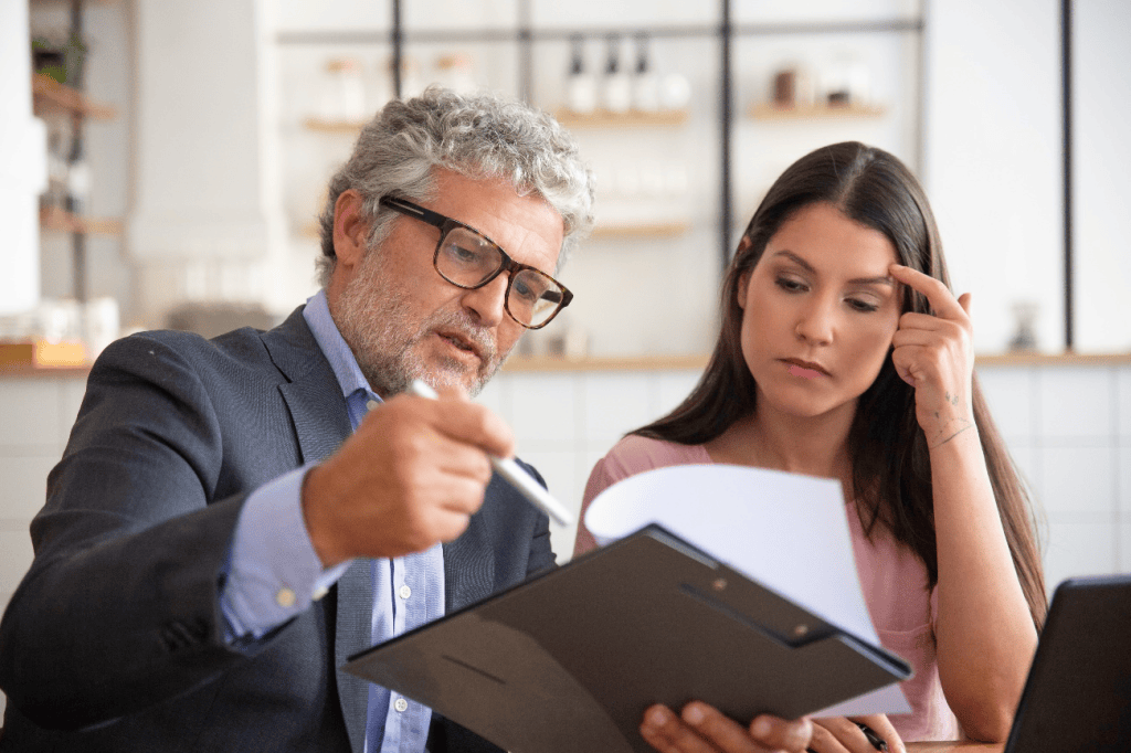 Lawyer explaining legal documents to a concerned female client