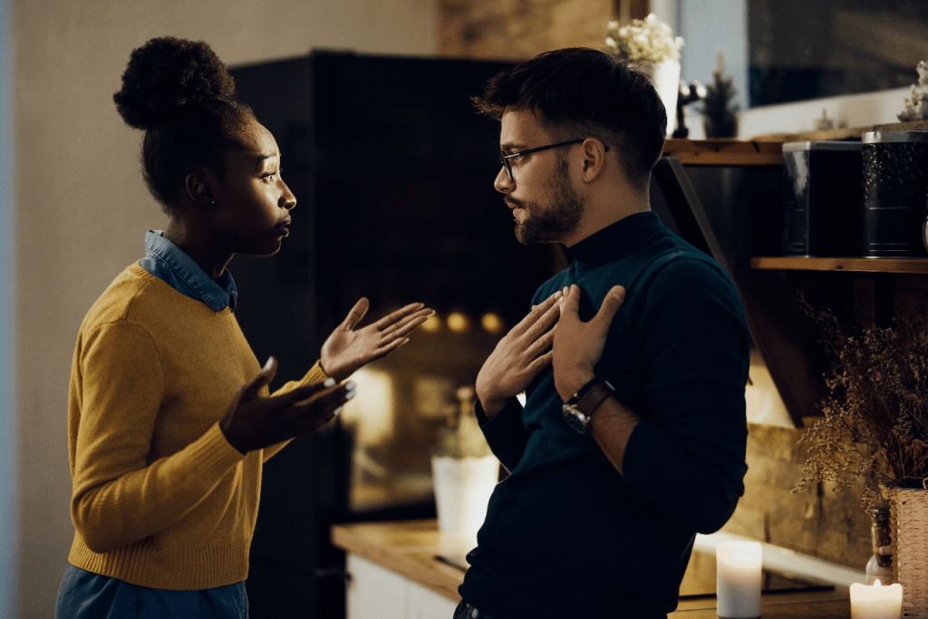 Woman expressing frustration to a man during a tense argument